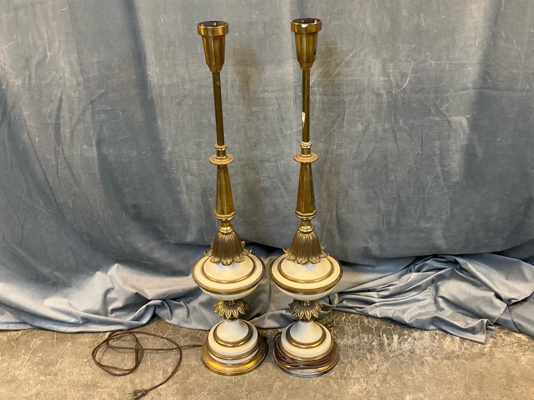 MCM Lamps: Circa 1960's pair of vintage brass lamps. Tested works, missing on and off knobs and globes. Measures 7 inches in diameter x 34 inches tall.