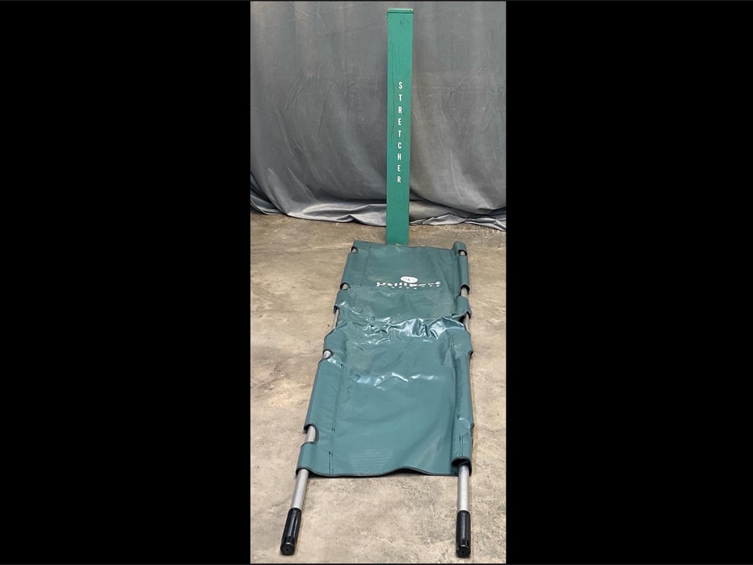 Vintage Stretcher: Late 20th century MSCO Utiliport Stretcher with metal case. Good condition. Metal case measures 4.25 inches wide x 4.25 x 40 inches tall.