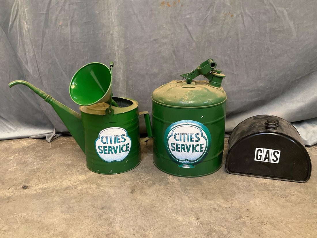 Gas Cans: One Model T repainted metal running board gas can with 1918 patent mark and ""GAS" decal. Dented. One repainted vintage metal gas can with ""Cities Service" decal. Dented. One metal funnel and metal