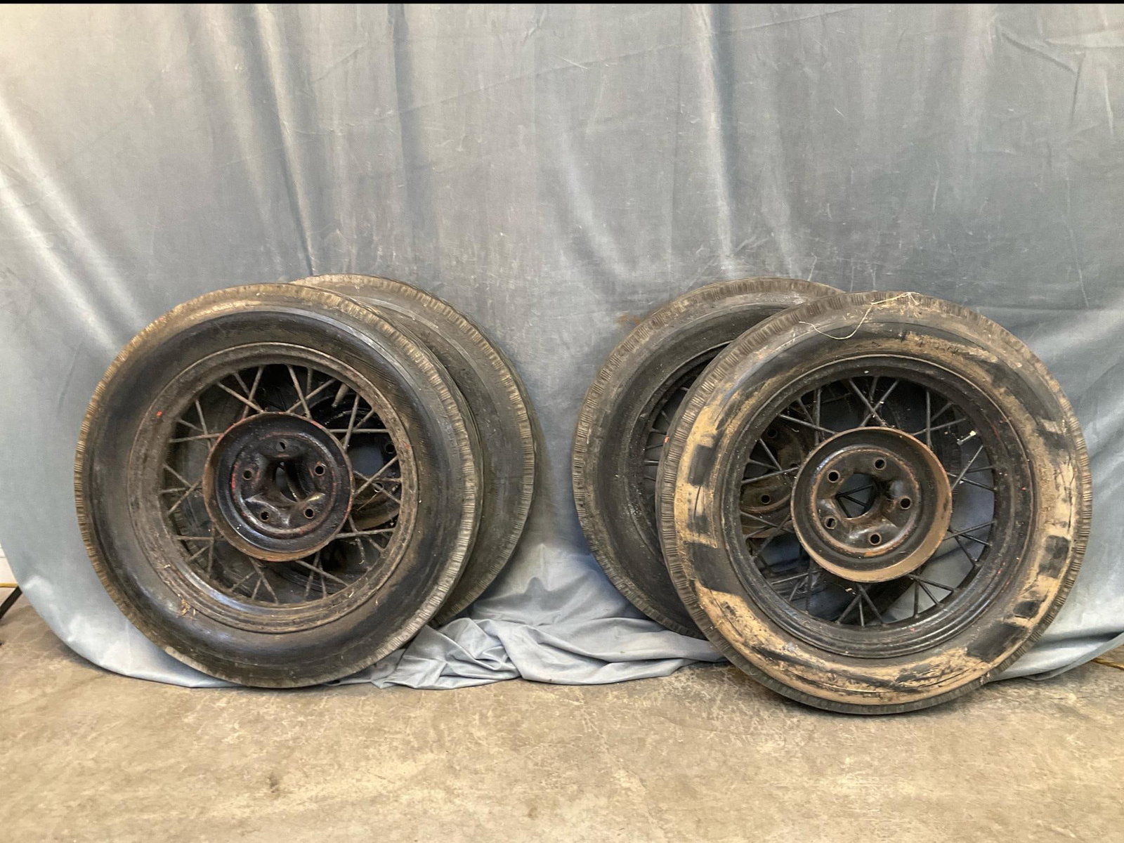 Model A Wheels: Four Model A wire wheels with Sears Allstate Tires. Used condition. Measures 28.5 inches in diameter x 6 inches wide.