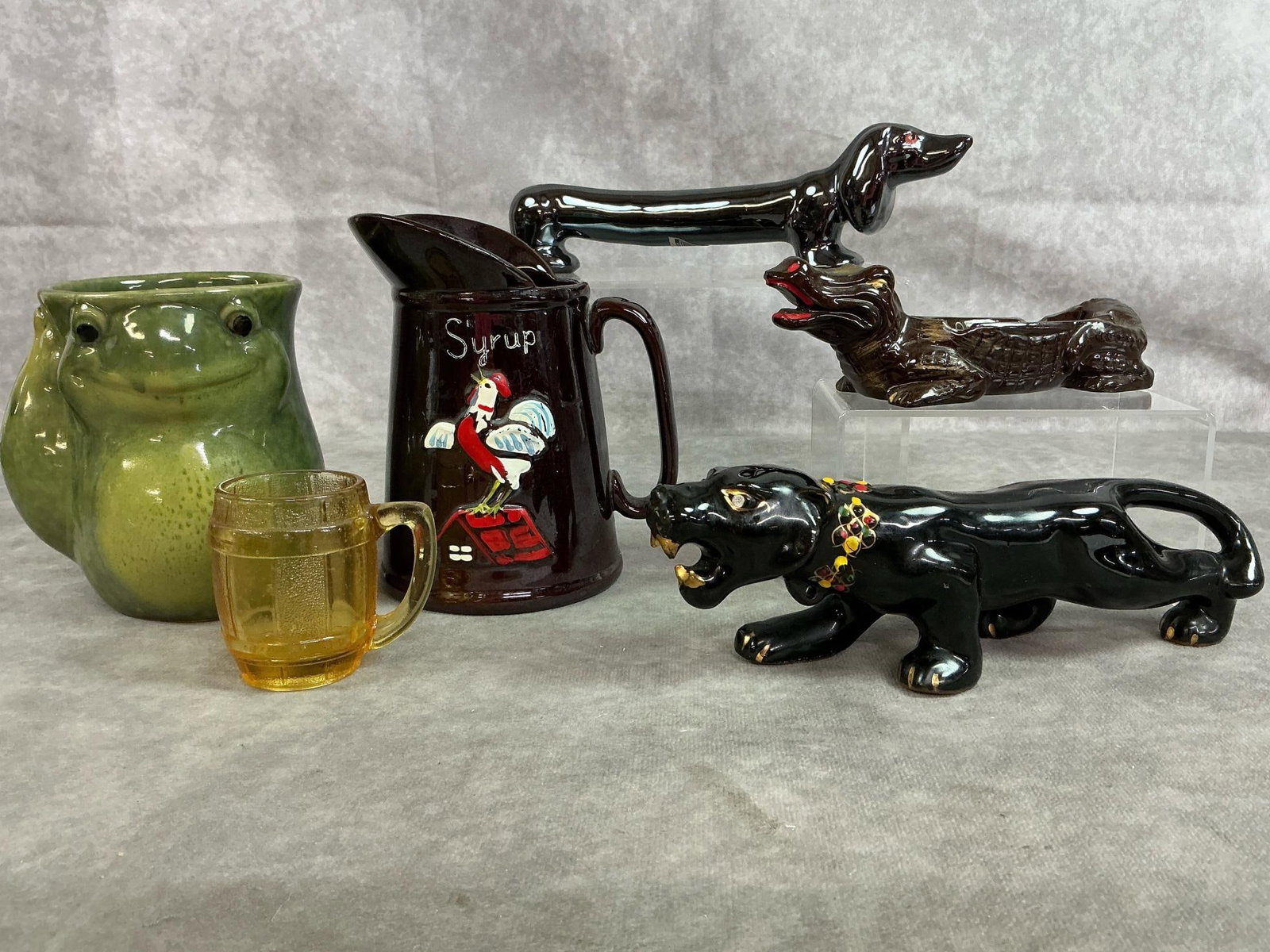 Fun Collectibles: Six mid to late 1900's collectibles. MCM black panther figure, Florida souvenir alligator ashtray, and long dachshund salt shaker. Includes Redware syrup pitcher with rooster, smiling frog mug, and