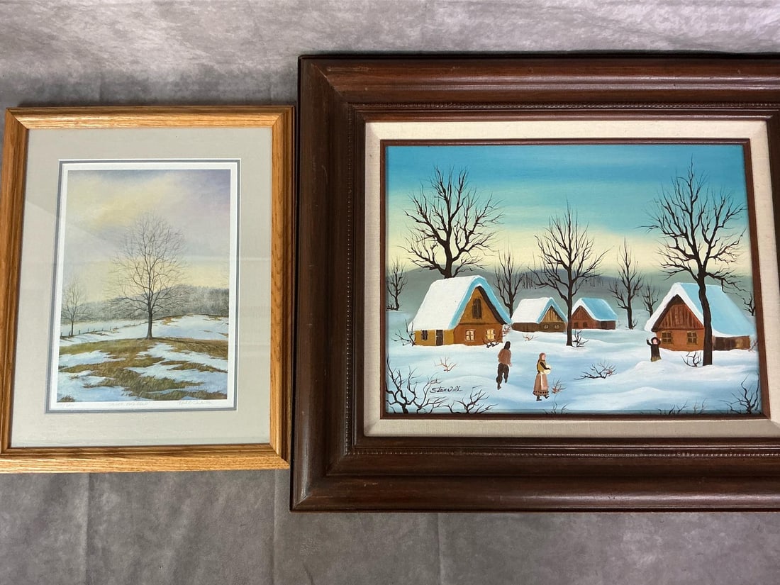 Snowy Scenes: Two matted and framed art pieces. Robert Tuckwiller's "Silver and Gold" print #104/500. Oil painting of rustic cottages in snowy landscape appears to be signed by Stan Wells. Both in good condition.