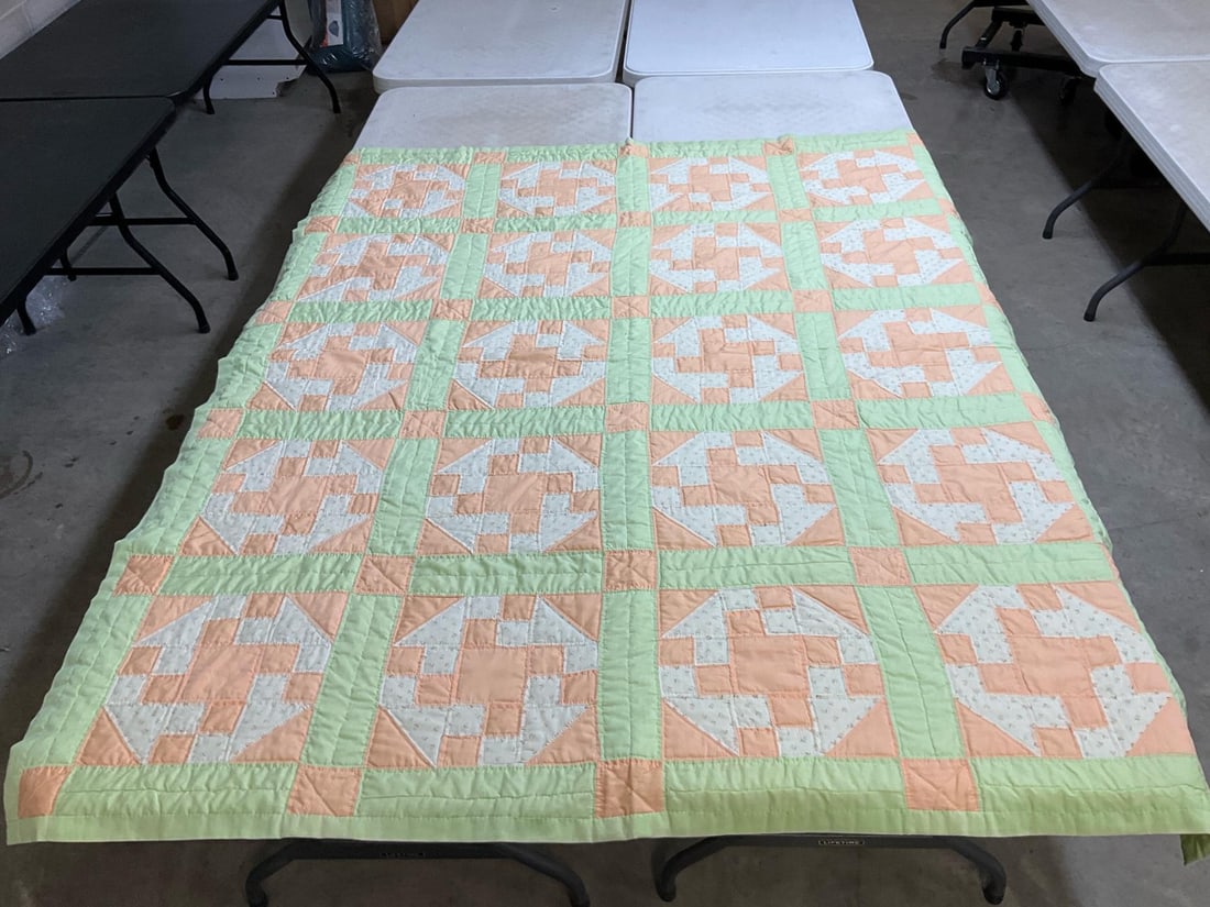 Homemade Quilt: Vintage homemade quilt, machine stitched and quilted. One small stain on back, otherwise good condition. Measures 64 inches wide x 79 inches long.