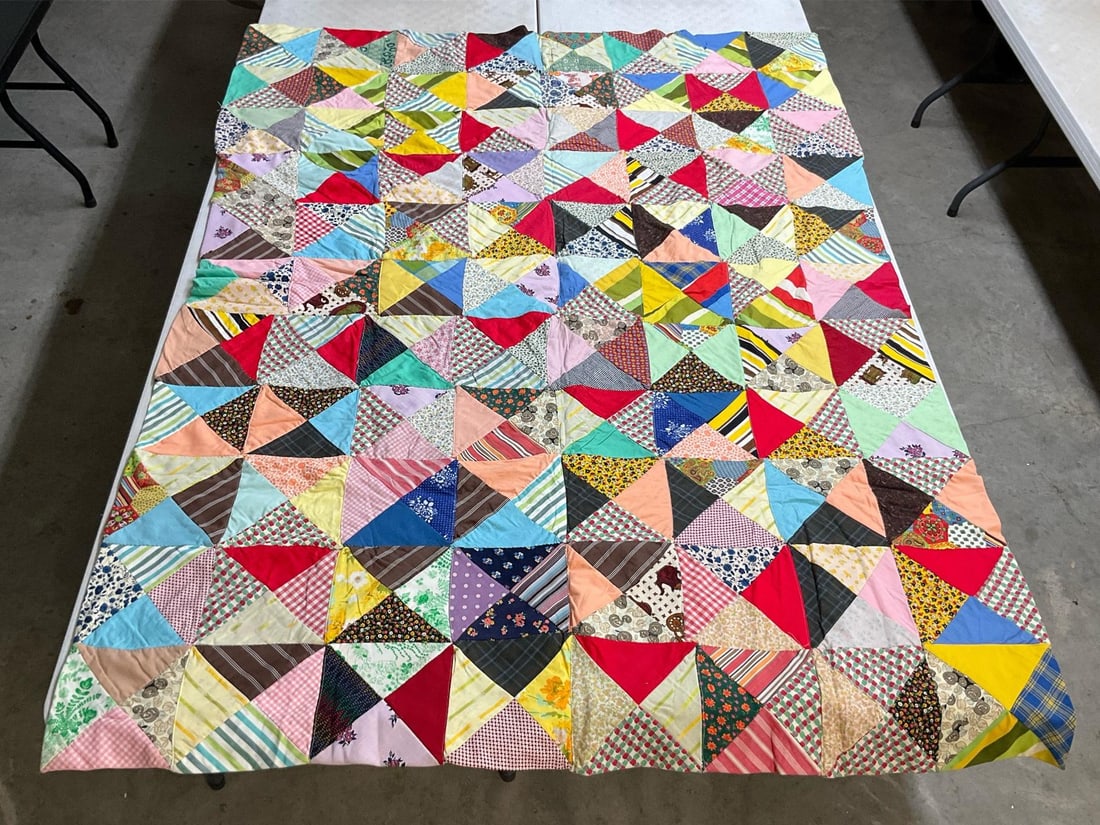 Double-Sided Quilt: Homemade vintage double sided quilt, combination of machine and hand stitching. Good condition. Measures 61 inches wide x 82 inches long.