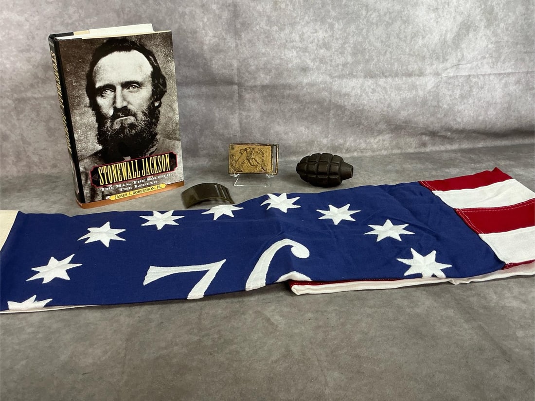 1976 Flag, Stonewall Jackson Book, Grenade and Belt Buckles: Five collectible items from early to late 1900's. Unused 3 foot x 5 foot 1976 American flag by Valley Forge Flag company. Stonewall Jackson by James I Robertson, Jr., inert MK11 grenade, and two belt