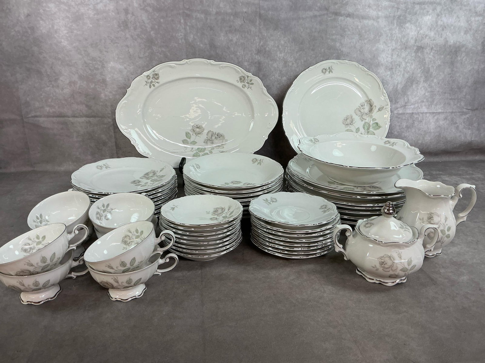 Mystic Rose Dinnerware: Fifty-two pieces of German made Mystic Rose pattern dishes. Made by Mitterteich of Bavaria, includes 8 place setting of dinner plates, salad plates, dessert plates, fruit dish, cups and saucers. Also,