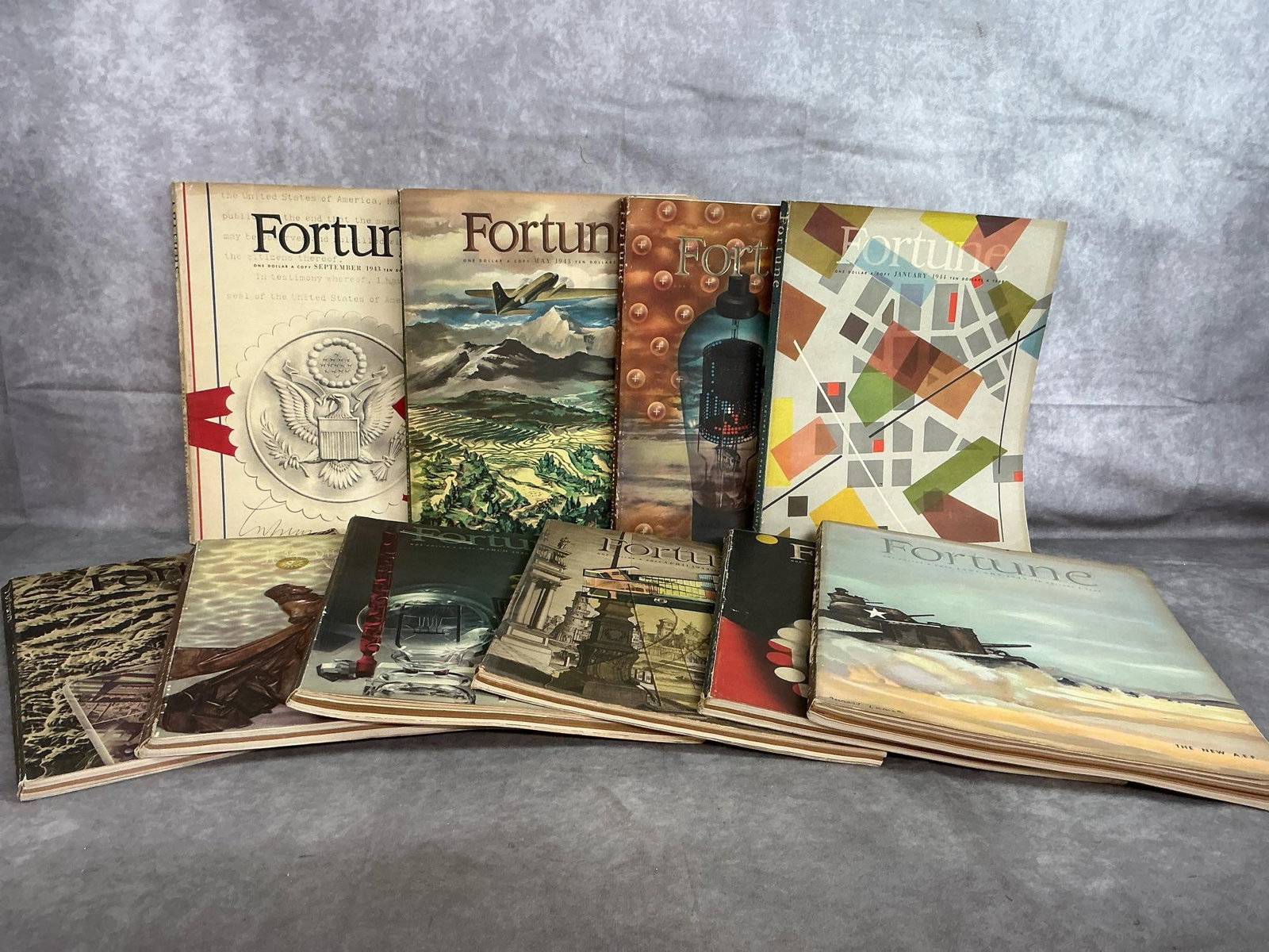 Fortune Magazines 1943: Ten 1943-1944 Fortune Magazines. Some loose pages and foxing present, otherwise in good condition. Each measures 12 inches wide x 14 inches tall.