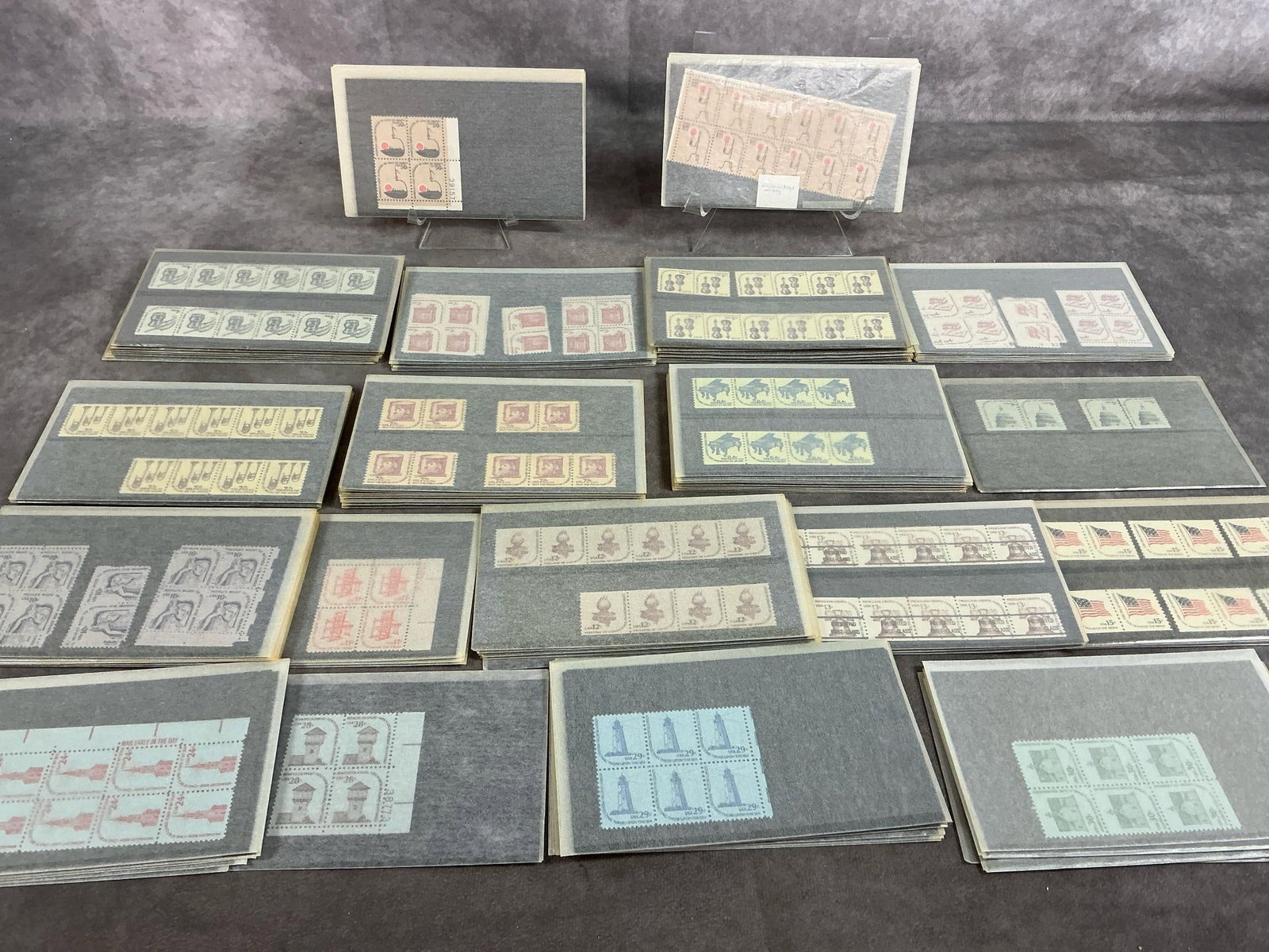 Vintage US Stamps: Several hundred vintage United States Postage stamps. Includes a hundred $1 stamps. A few are postmarked, most are unused. Includes multiple 1976 "Beat the Drum" stamps originally worth 7.9 cents.