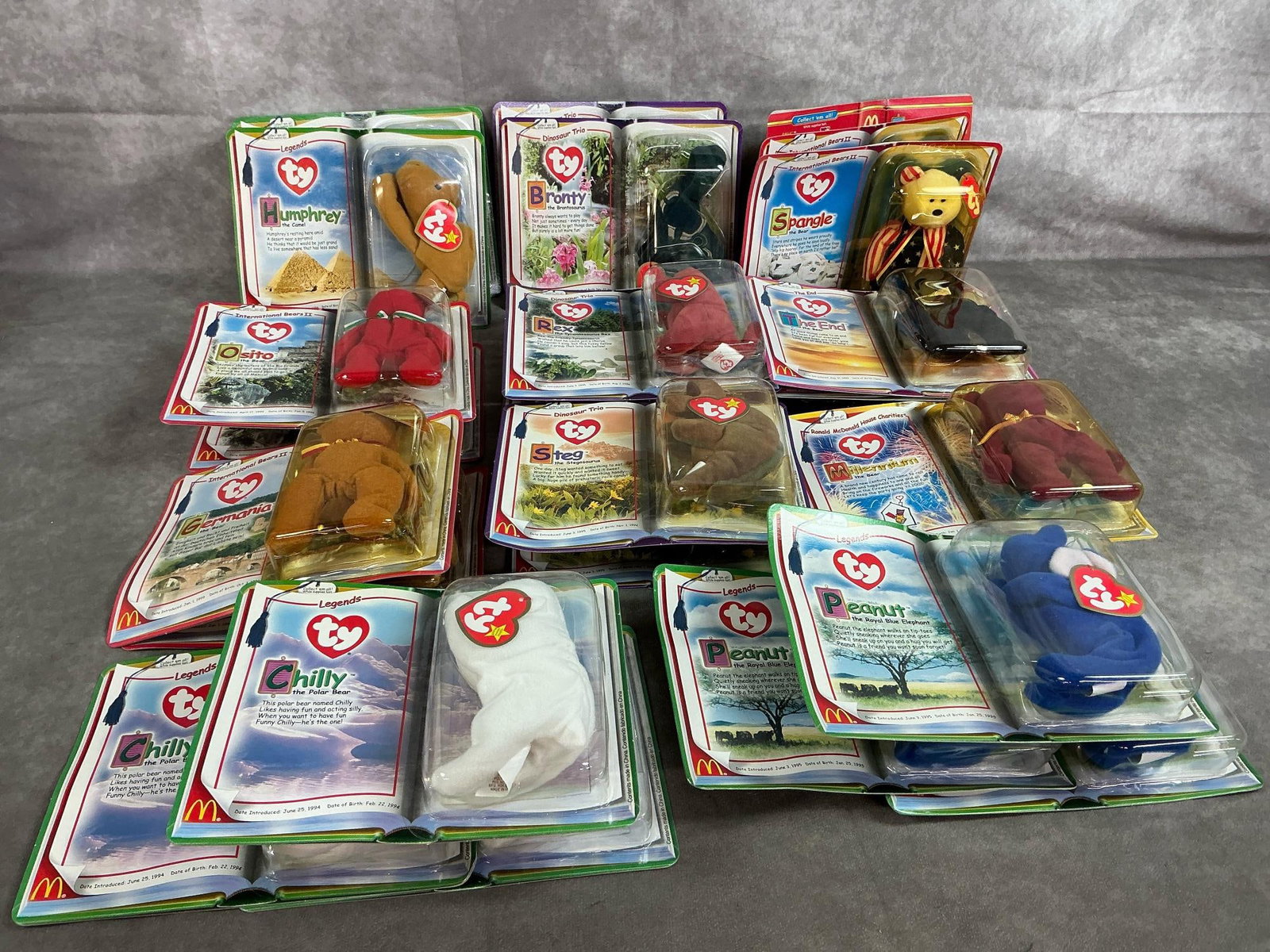 McDonald's Ty Legends: Twenty-five Happy Meal toys from 2000. Includes Ty mini babies from various countries, Dinosaurs, and House Charities. In original packaging. Measures 7.5 inches wide x 1.5 x 6 inches tall.