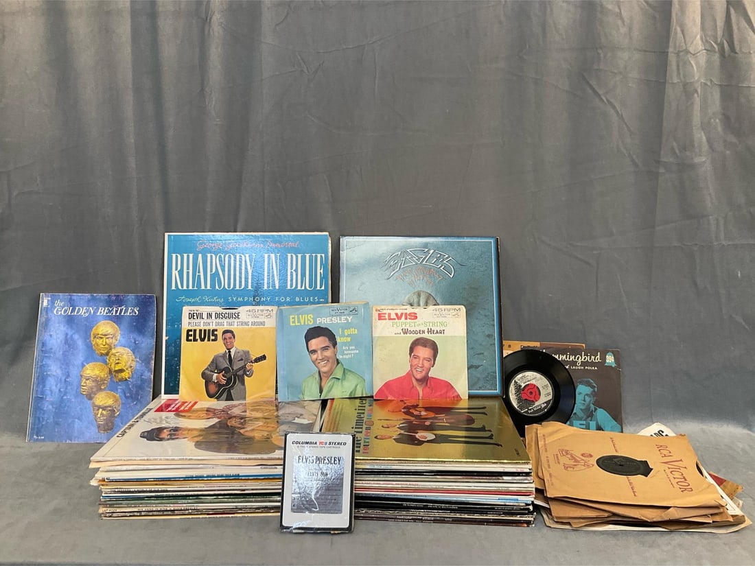 Assorted Records: Approximately fifty LPs, 45s, 78s, Elvis Presley 8-track tape and ""The Golden Beatles" sheet music booklet. Genres include; Spiritual, pop, Christmas, folk and soundtracks. Artists include; The