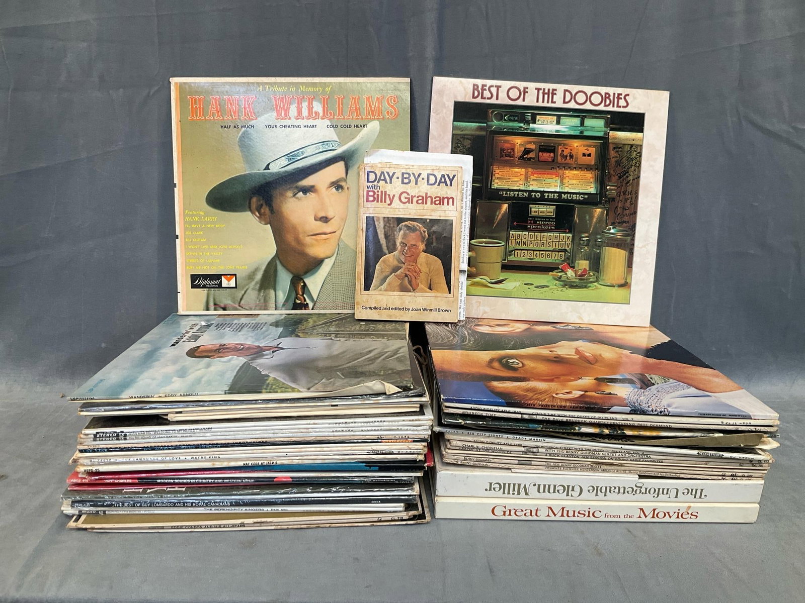 Assorted Vintage LPs: Approximately 40 1950's-1970's LPs consisting of classic country, pop, rock, jazz and movie soundtracks. Some artists include; Dean Martin, Glenn Miller, Benny Goodman, Eddy Arnold and The Doobie