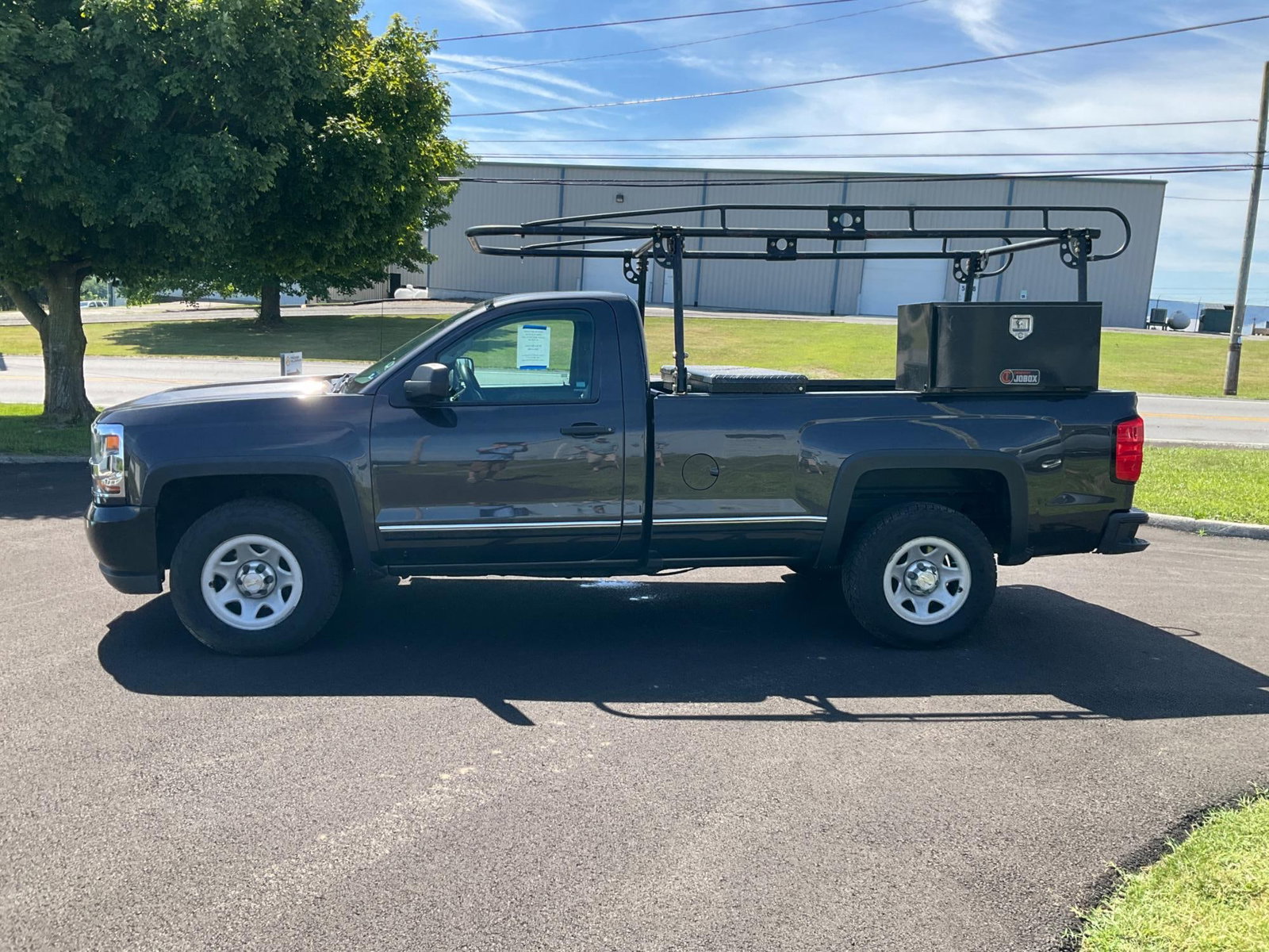 Chevrolet Silverado: 2016 Chevrolet Silverado Flexfuel regular cab, 4WD grey truck with 138,336 miles. Remote keyless entry, power windows and door locks, AM/FM, USB & Aux, Bluetooth, digital and manual controls, digital