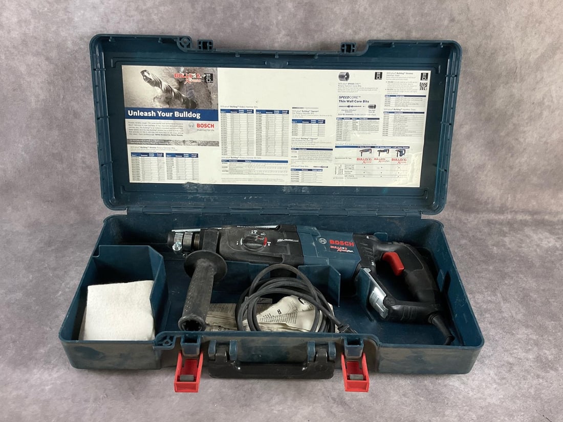 Bosch Hammer Drill: GBH2-28L Bulldog Xtreme SDS-plus corded hammer. Used, powers up and in working condition. Slight damage on rubber boot around chuck. Case measures 22 1/2 inches long X 11 inches wide X 4 1/2 inches de