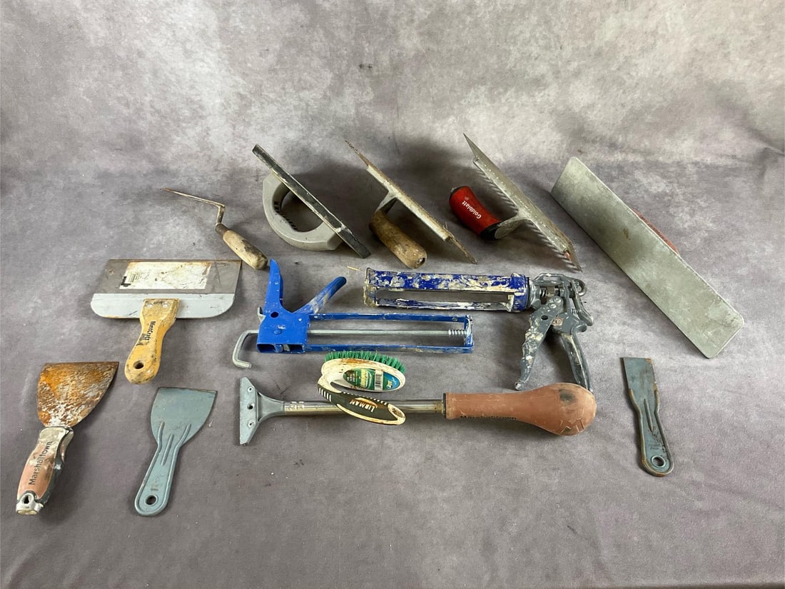 Assortment of Hand Tools: Trowels, putty knives, floats, caulking guns, floor scraper and plaster pans. All used and in useable condition. Box measures 20 inches long X 7 inches wide X 5 inches deep.