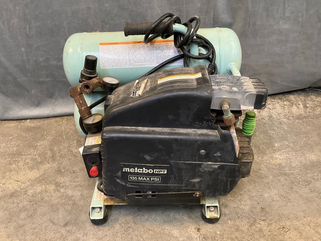 Metabo Portable Electric Compressor: Metabo HPT 4.0-Gallon Portable Electric 135 PSI Twin Stack Air Compressor. 15 Amp direct drive induction motor with industrial air pressure gauges. Used condition, tested and runs, hose not tested.