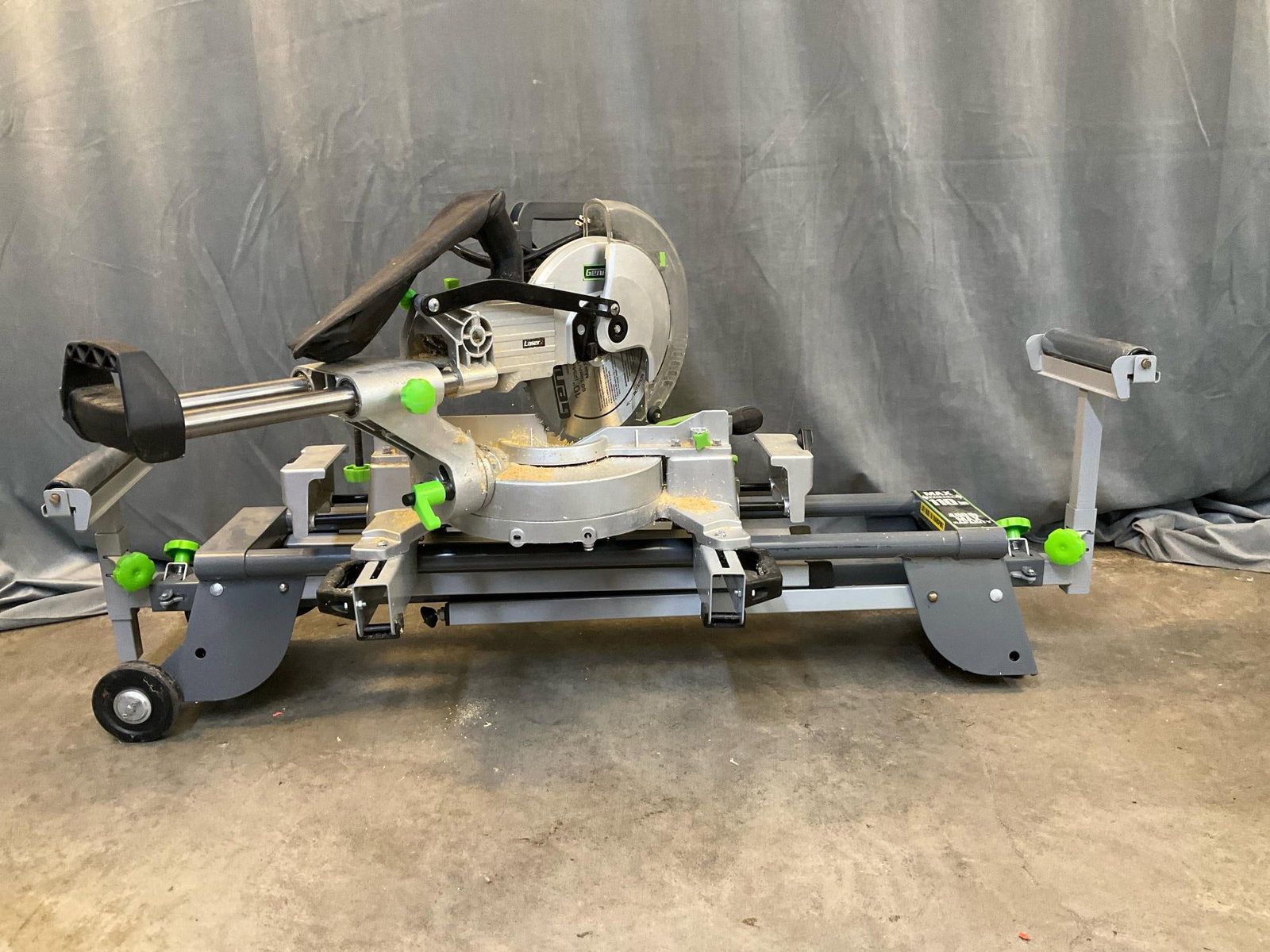 Genesis Compound Miter Saw: Genesis 10” Compound Miter Saw - GMSDR1015LC. Rated Power: 120v, 60Hz, 15 Amp. Good used condition, tested runs. Measures 53 inches wide x 28 x 24 x 25 inches tall.