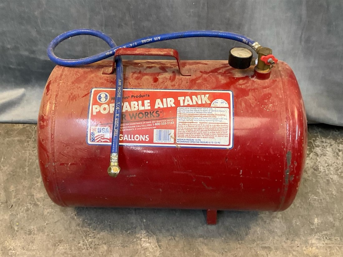 Portable Air Tank: Midwest Products Portable Air Tank, 9 gallons. Used condition, not tested. Measures 20 inches wide x 11 x 15 inches tall.