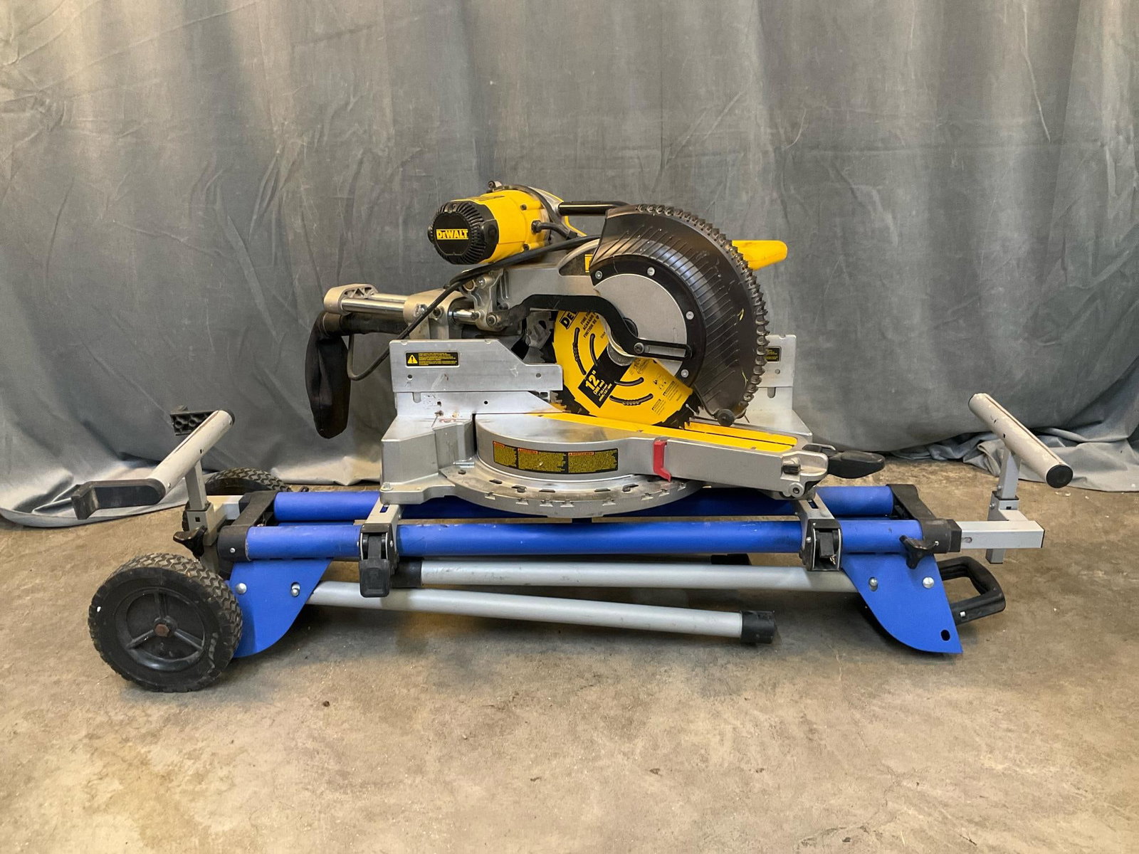 DeWalt Compound Miter Saw: DeWalt DWS779 12” 15 Amp Double Bevel Sliding Compound Miter Saw. Used condition, tested and works. Measures 54 inches wide x 24 x 26 inches tall.