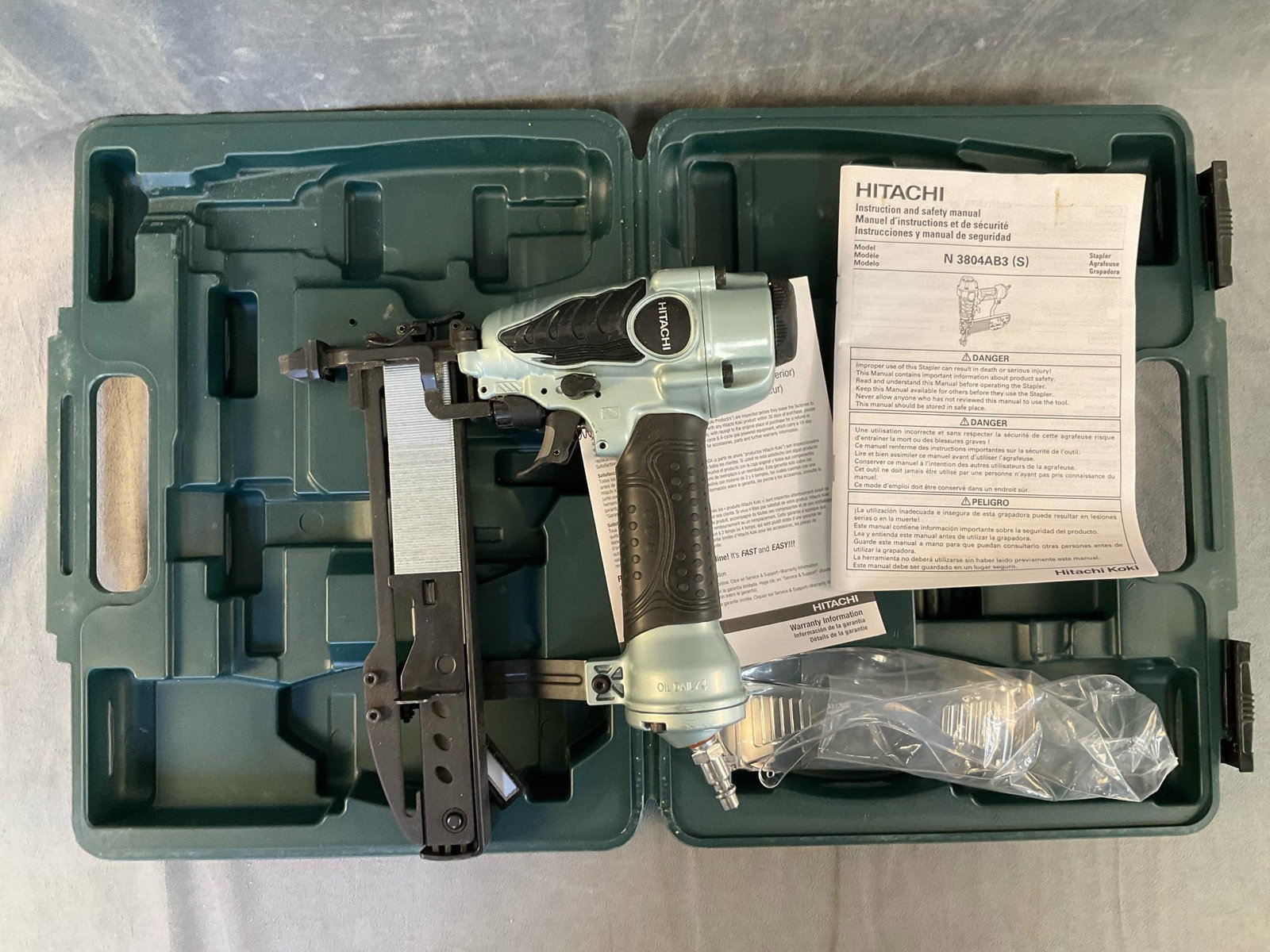 Hitachi Stapler Gun: Hitachi N3804AB3 (S) 1-1/2” stapler gun 70-120 PSI air power tool with safety goggles. Used condition, not tested. Case measures 14 inches wide x 3 x 11 inches tall.
