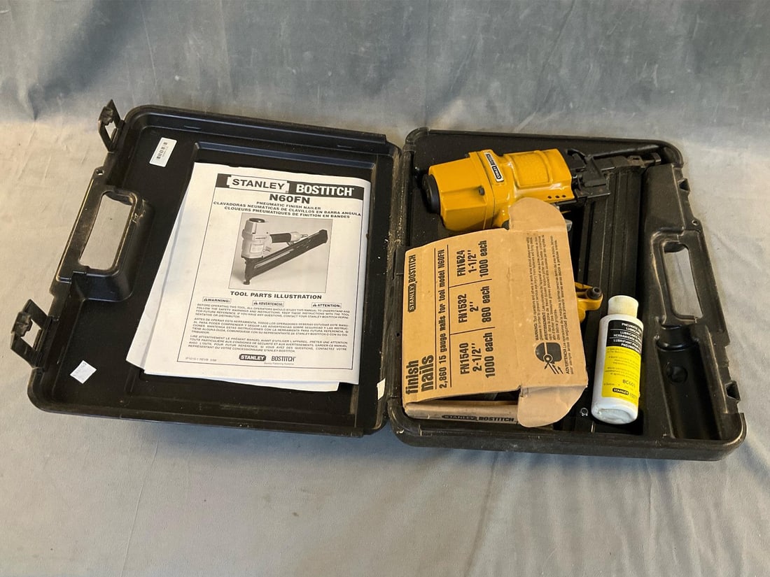 Stanley Pneumatic Nailer: Stanley Bostitch N60FN pneumatic finish nailer with finish nails and lubricant. Not tested, used condition. Case measures 16 inches wide x 4 x 14 inches tall.