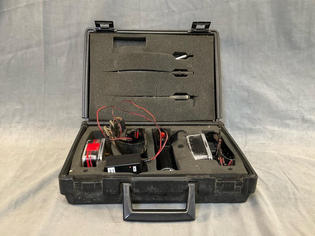 Dog Training Shock Collar: Vintage TriTronics shock collar dog training set with plastic case. Used condition with some corrosion and wear. Untested. Case measures 13.5 inches wide x 4 x 10 inches tall.