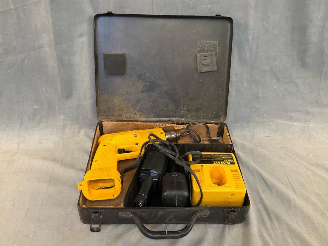 DeWalt Drill: DeWalt cordless drill with two 9.6 volt batteries, battery charger and metal case. Used condition, tested and works. Case measures 13.75 inches wide x 3.25 x 10.25 inches tall.
