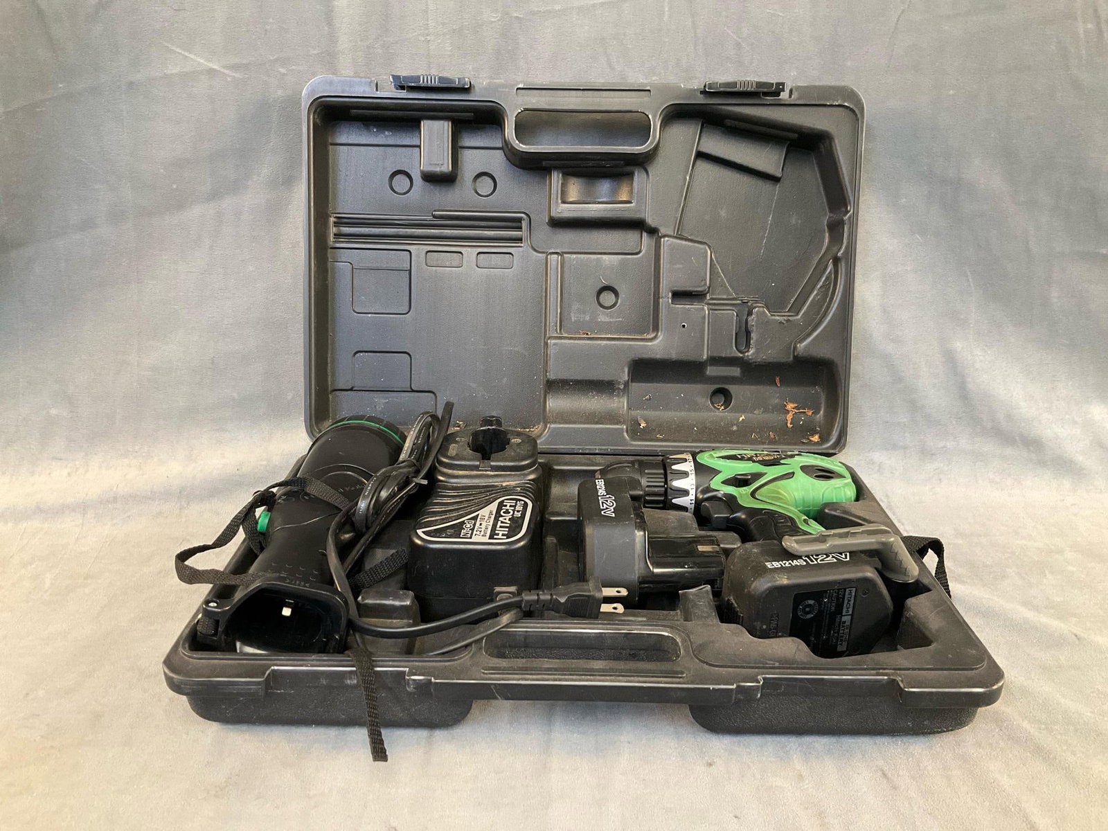 Hitachi Drill & Flashlight: Hitachi Model 12DVF3 Cordless Drill and Hitachi Model UB 12D Cordless Flashlight with case, two batteries and charger. Used condition, tested works. Case measures 17.5 inches wide x 11.5 x 4.5 inches 