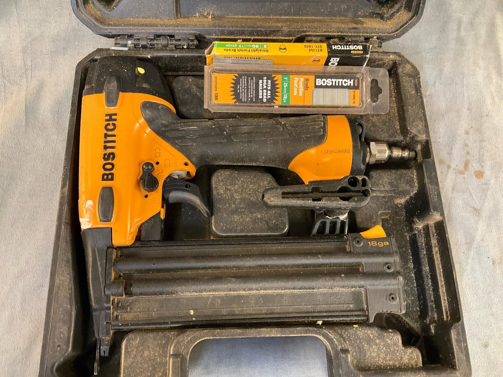 Bostitch Pneumatic Nailer: Bostitch Model BT1855 Pneumatic Brad Nailer & Stapler with two opened brad packs. Used condition, not tested. Case measures 11.5 inches wide x 11.5 x 4.5 inches tall.