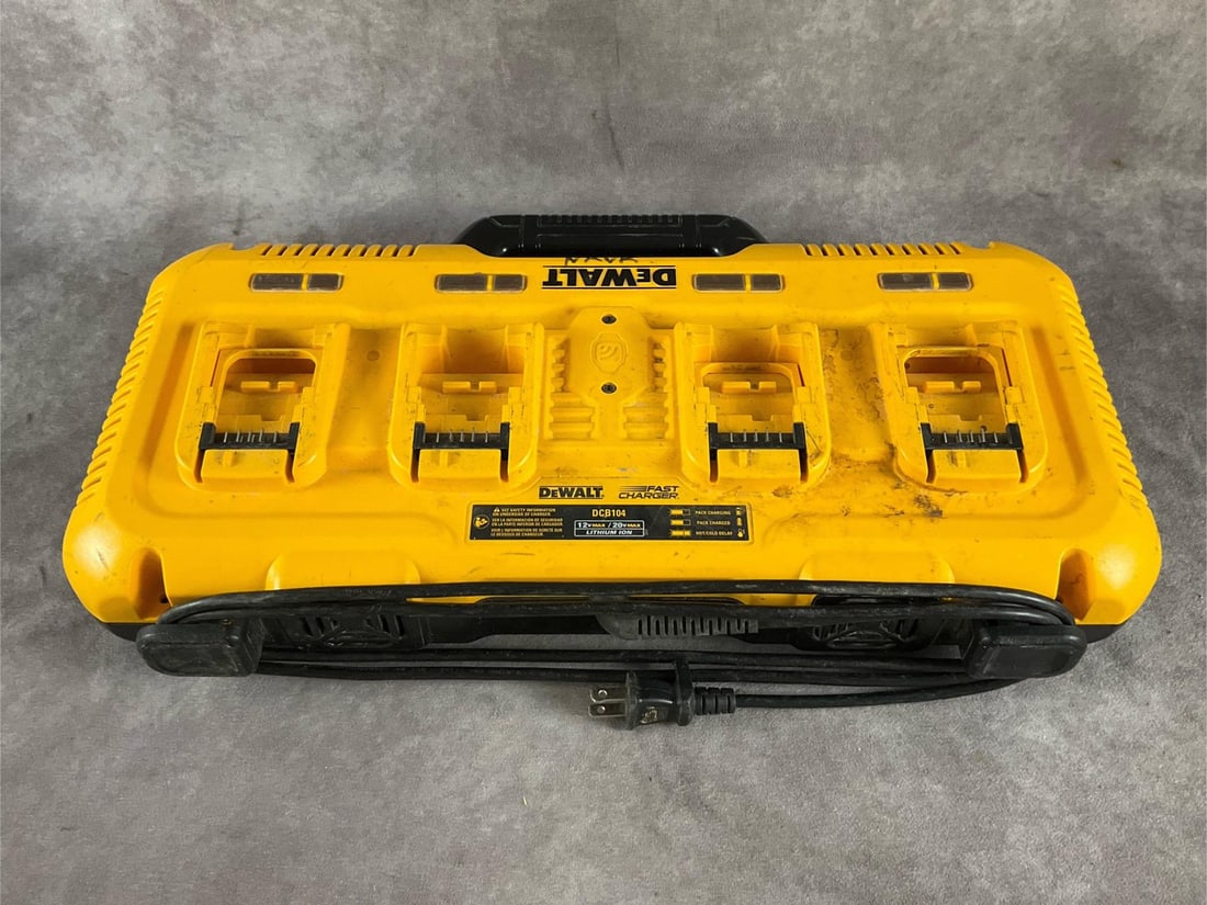 Dewalt Charger: DCB104 20 volt lithium-ion charger. Four charging ports. Used, powers up, and charges batteries. Measures 21 inches long X 11 inches wide X 4 inches high.