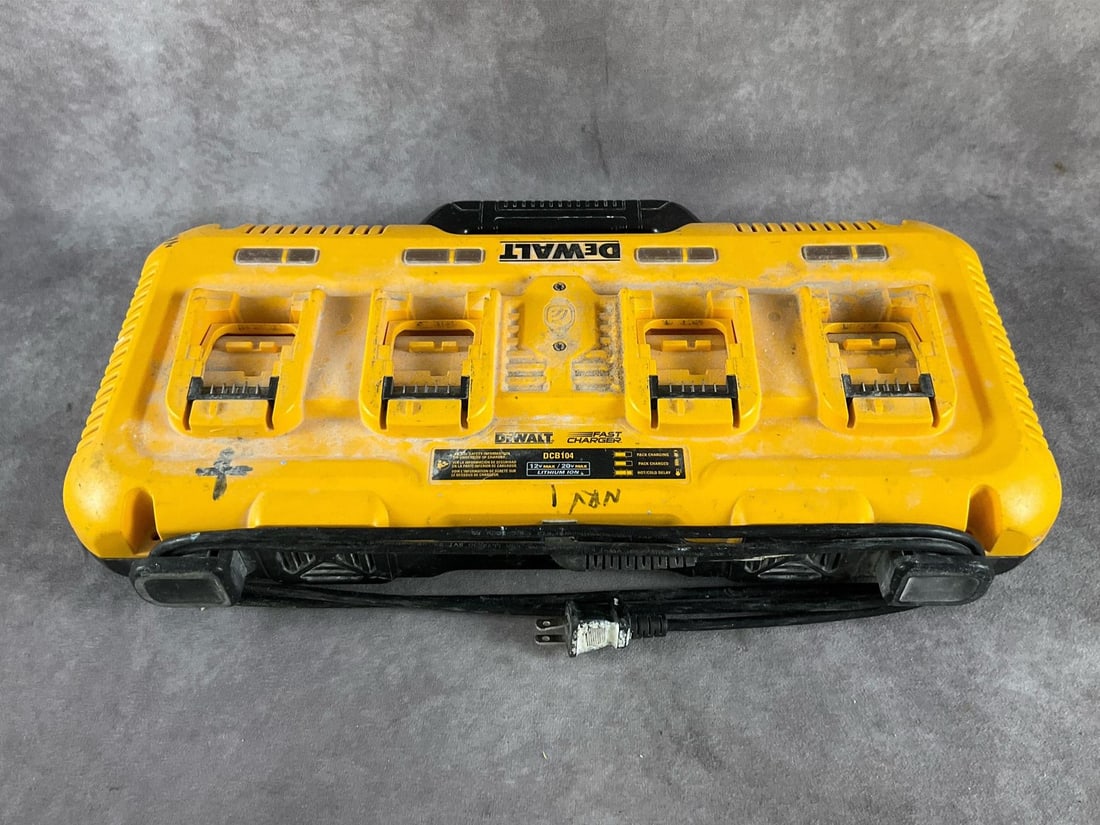 Dewalt Charger: DCB104 20 volt lithium-ion charger. Four charging ports. Used, powers up and charges batteries. Measures 21 inches long X 11 inches wide X 4 inches high.
