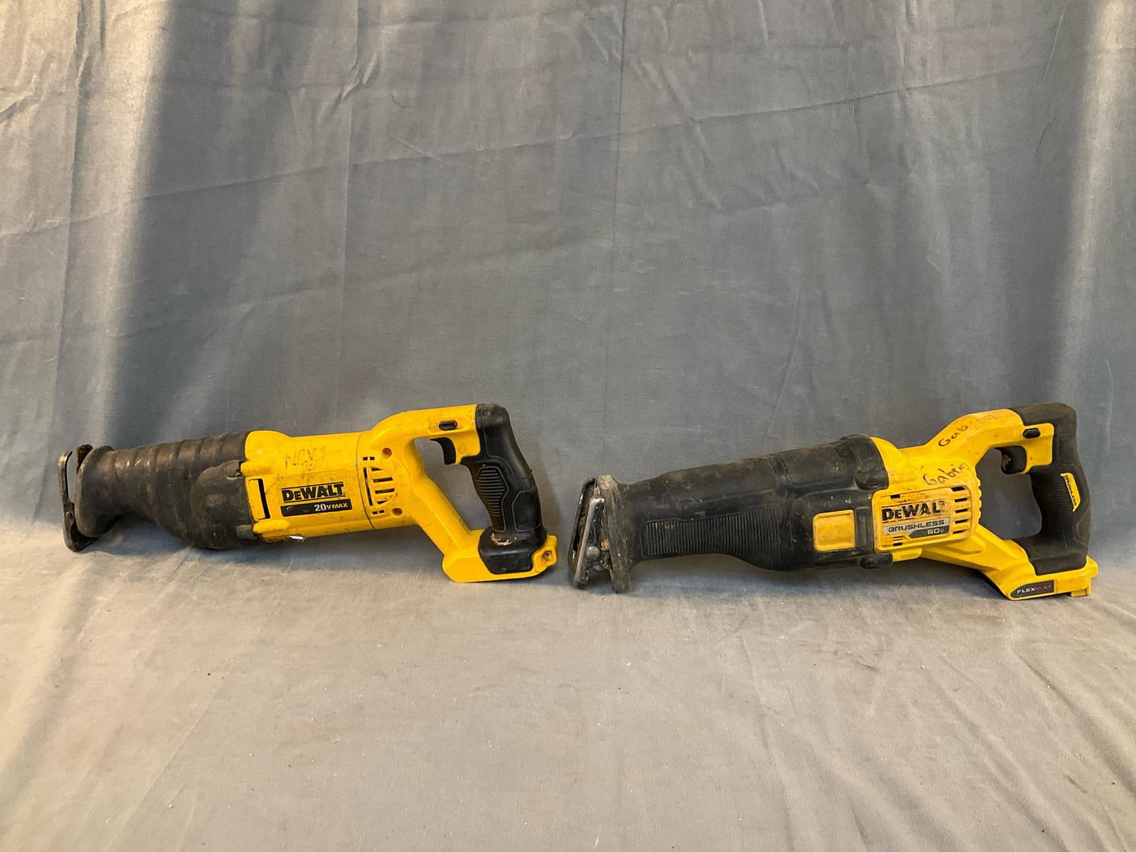 DeWalt Reciprocating Saws: Two DeWalt variable speed reciprocating saws. One DCS381 Type 1 20 volt and one DCS389 type 1 60 volt. Missing batteries. Used condition, tested and work. Batteries missing. Measures 18 inches wide x