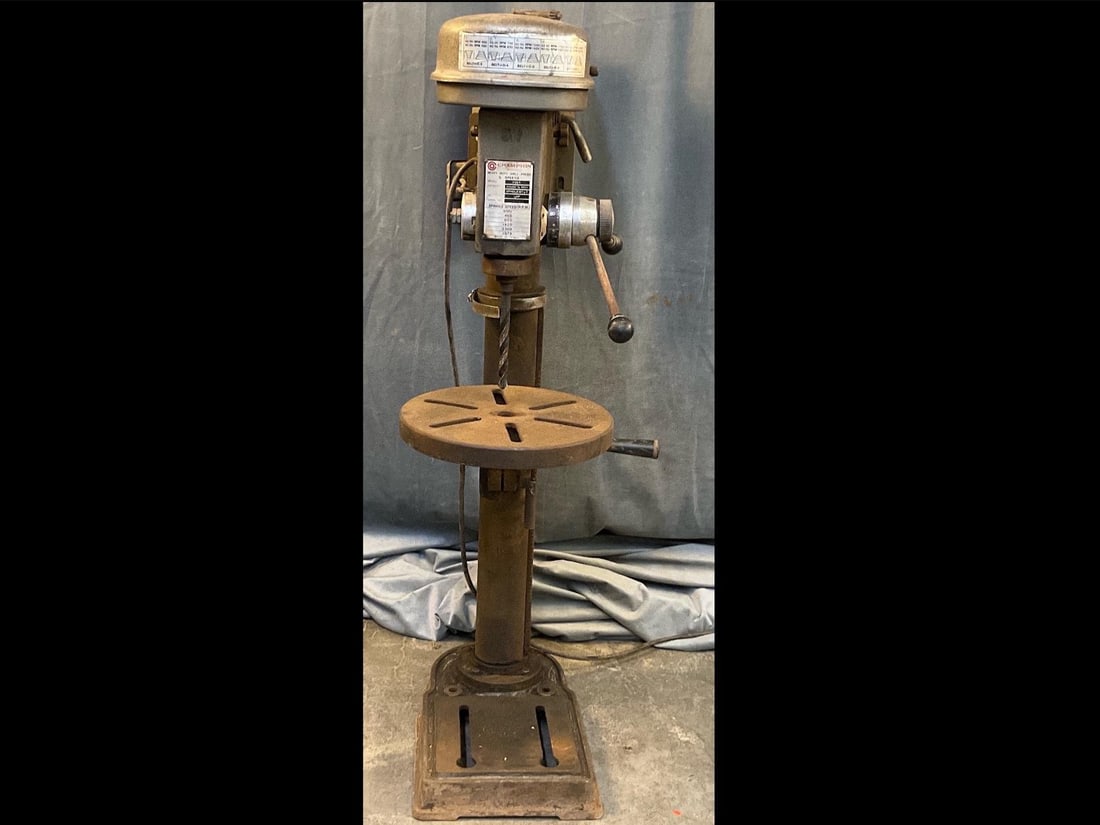 Drill Press: Champion Machinery Heavy Duty 5 Speed Drill Press. Model FOO 1. Chuck 5/8 “ , 1/2 HP. Used condition, powers on and works. Measures 11 inches wide x 16 x 42 inches tall.