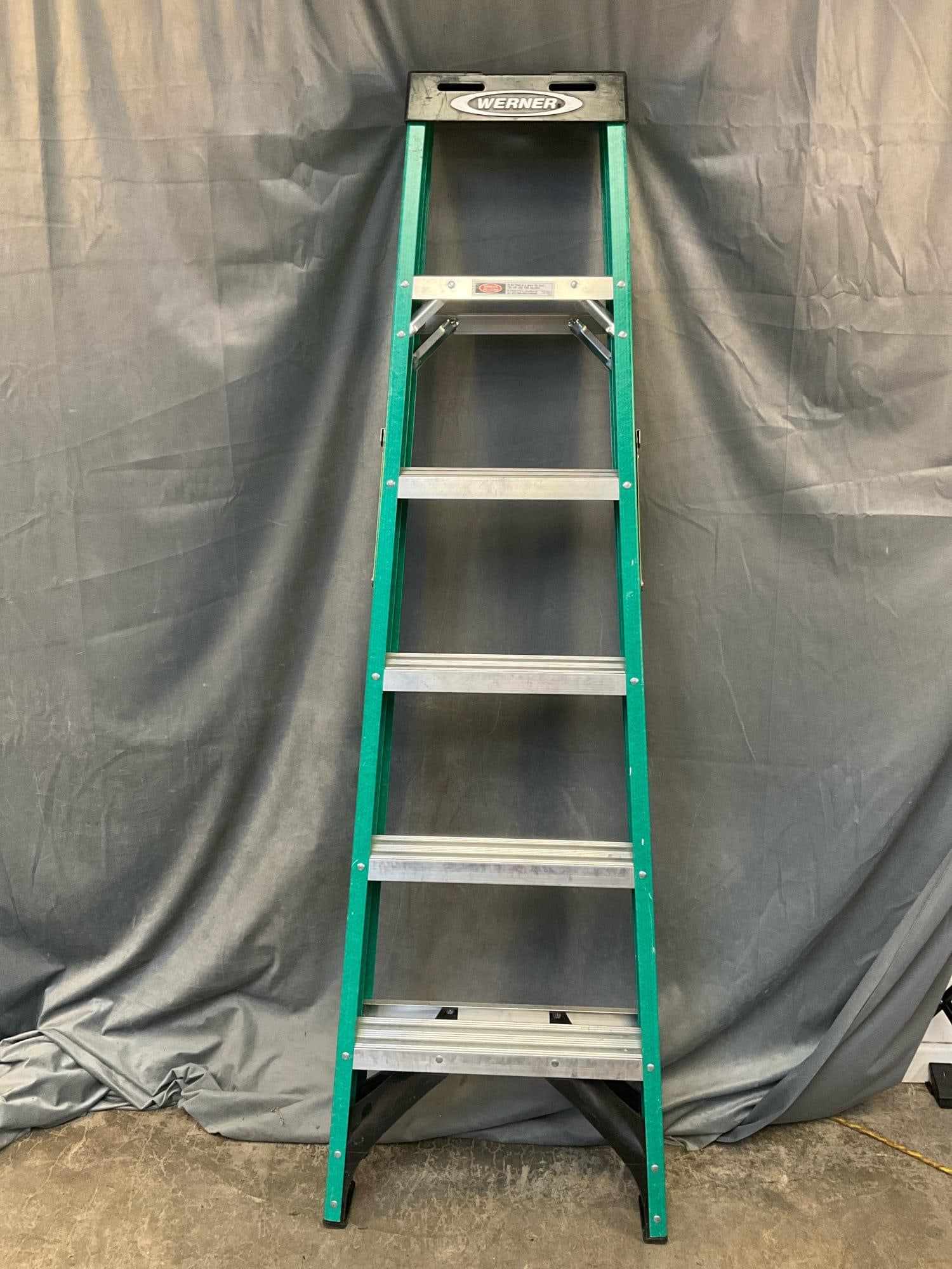 Werner Step Ladder: Werner 6ft. aluminum step ladder with 10ft. maximum reach and 3ft.10in. highest standing position. Used, good working condition. Folded measures 21.5 inches wide x 6 x 72 inches tall.