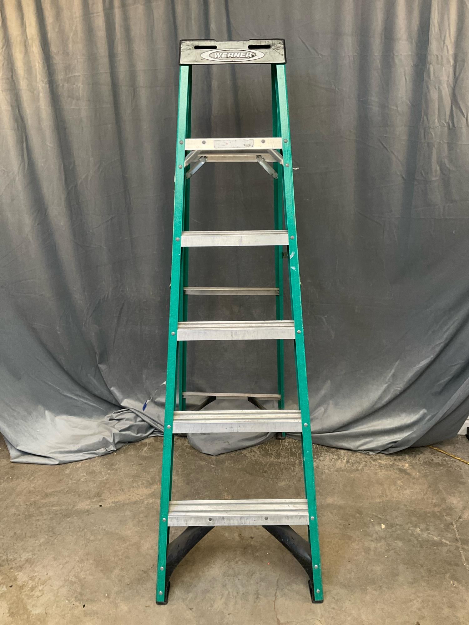 Werner Step Ladder: Werner 6ft. aluminum step ladder with 10ft. maximum reach and 3ft. 10in. highest standing position. Used, good working condition. Folded measures 21.5 inches wide x 6 x 72 inches tall.