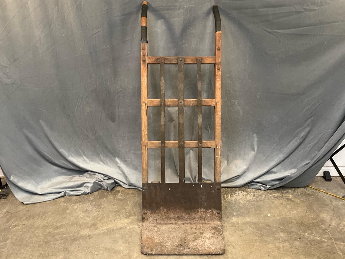 Hand Truck: Vintage Industrial Homas wood and metal hand truck. Good used condition. Measures 20 inches wide x 22 x 51 inches tall.