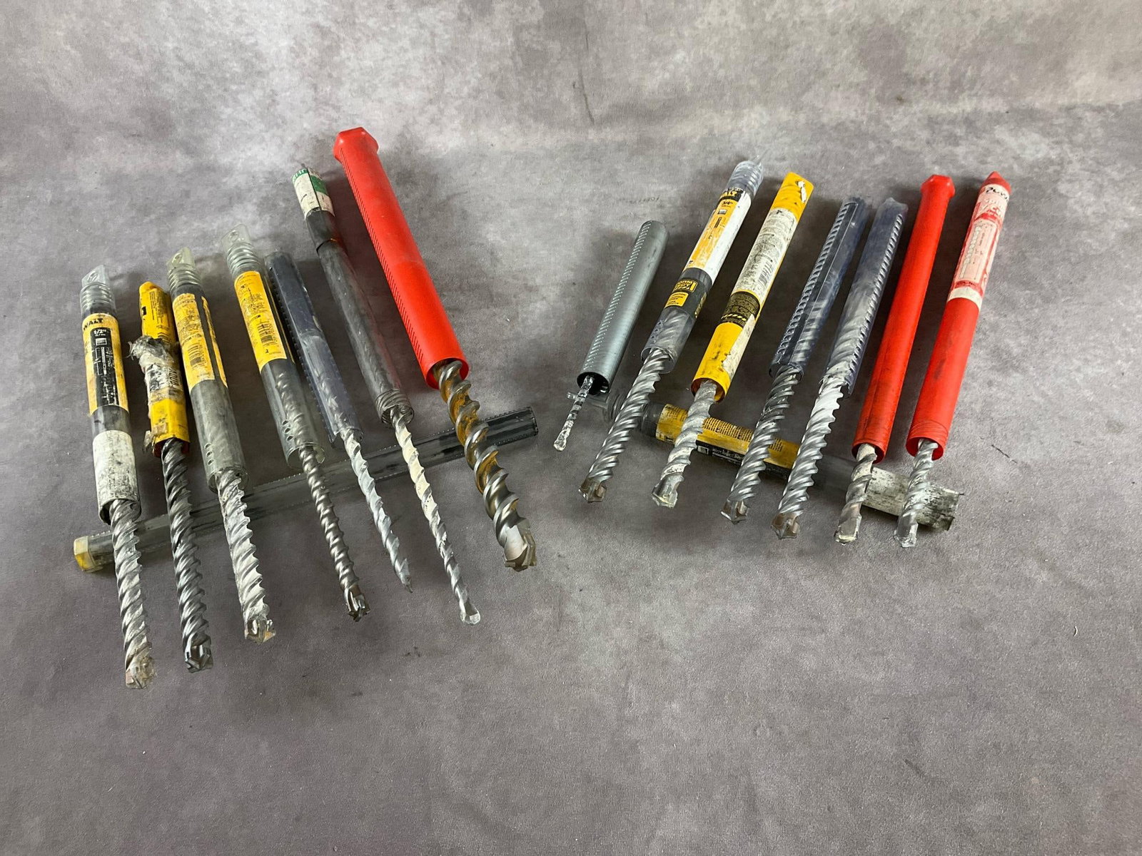 Assorted HammerDrill Bits: Various manufacturers. Spline drive. Sizes 1/4, 1/2, 5/8, 3/4, 7/8 and 1 1/8 inch. Used and in good condition.