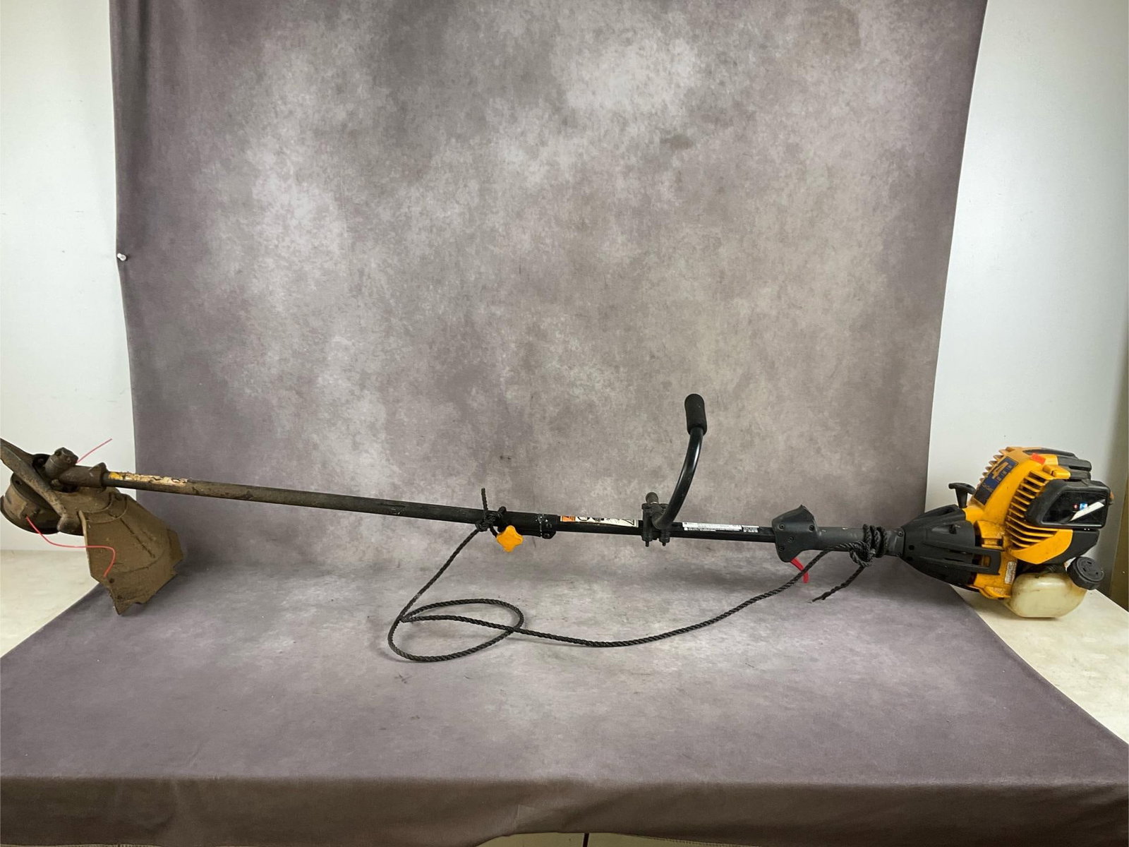 Cub Cadet String Trimmer: CC 4175 26cc straight shaft trimmer. No oil mixture required, uses gas only. Used, untested in good condition. Measures 71 inches long X 9 inches high X 11 inches high.
