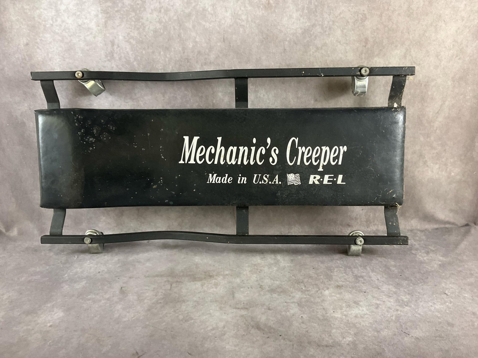 REL Creeper: Mechanic’s creeper. Used, otherwise in good condition. Measures 36 inches long X 18 inches wide X 4 inches high.