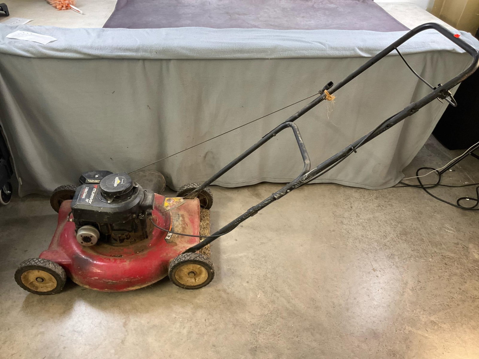 Murray Lawn Mower: 3.5 hp, Briggs & Stratton engine, 20 inch cut, push mower. Used, untested. Measures 68 inches long X 24 inches wide X 37 inches high.