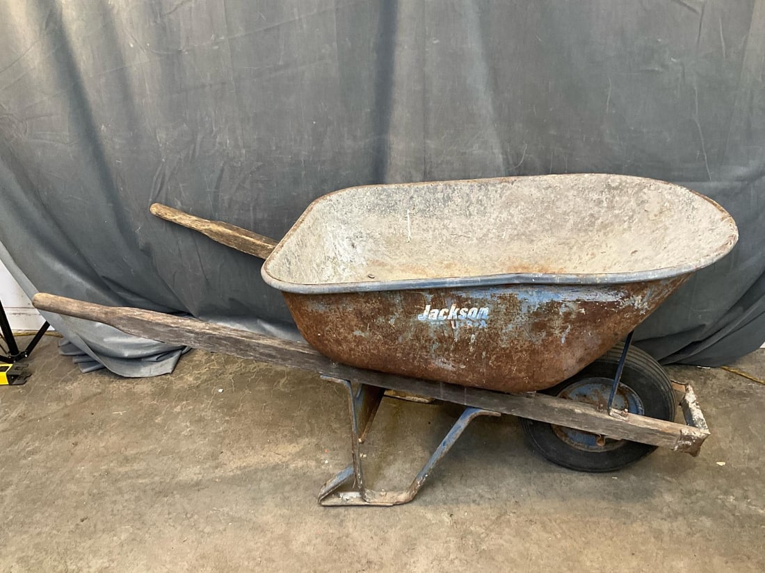 Wheelbarrow: Jackson Wheelbarrow. Used condition. Measures 61 inches wide x 25 x 27 inches tall.