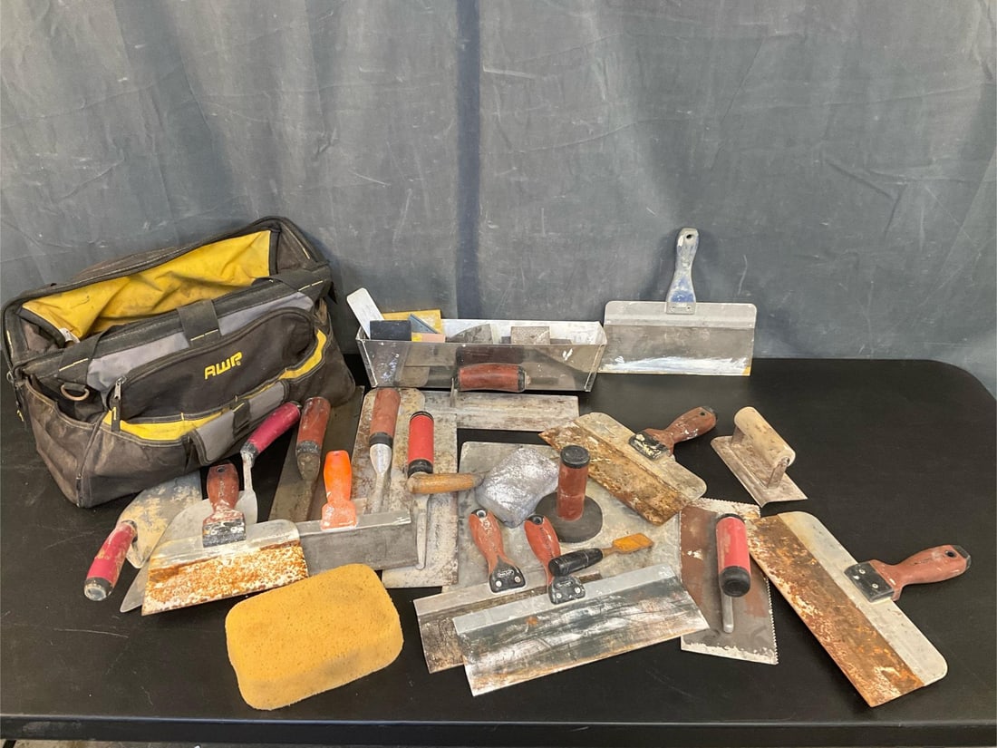 Trowels: Approximately 15 trowels and nylon AWP tool bag. Used condition. Bag measures 19 inches wide x 8 x 10 inches tall.
