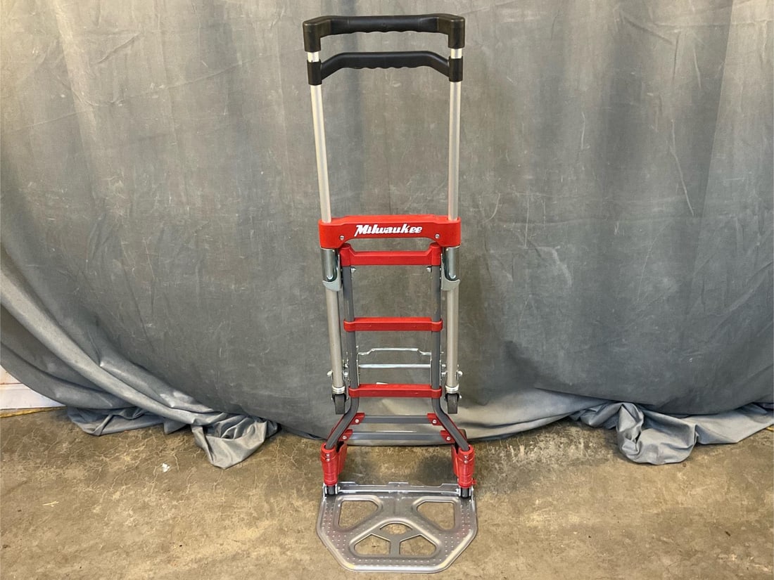 Convertible Hand Truck: Milwaukee convertible 2 in 1 hand truck. Converts from a two wheel hand truck to a four wheel platform cart with a quick release foot lever. Good condition. Folded measures 15.5 inches wide x 16 x