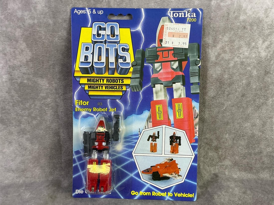 Go Bots: 1983 Go Bots Fitor, Enemy Robot Jet figure made by Tonka, Japan. In original sealed packaging with some mild bowing to cardboard. Measures 6 inches wide x 9 inches tall.