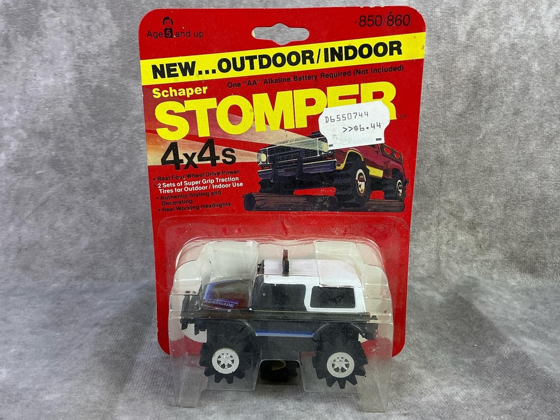 Schaper Stomper: 1980 Jeep Renegade car made by Schaper, Hong Kong. In original sealed packaging with mild bowing to cardboard. Measures 4.75 inches wide x 6.5 inches tall.