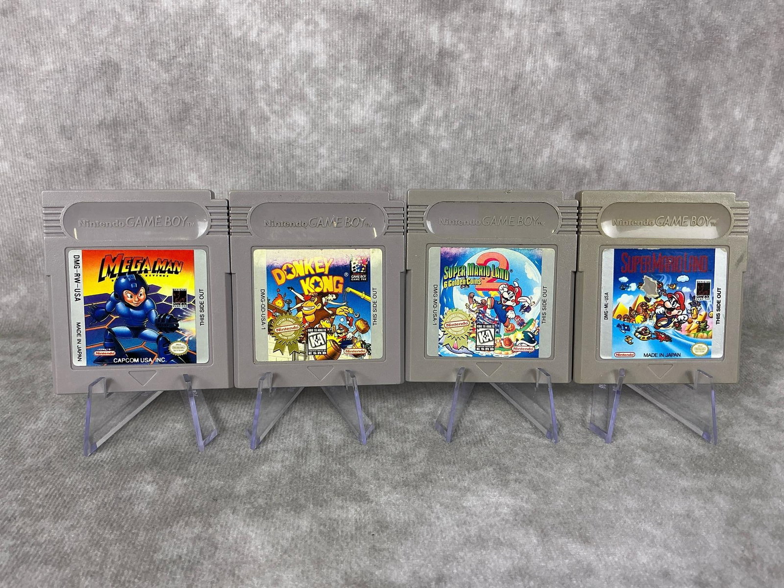 Game Boy Games: Four 1980s Nintendo Game Boy games made in Japan. Includes Mega Man, Donkey Kong, Super Mario Land, and Super Mario Land 2. All are untested, some discoloration and wear to front decal. Each one measu
