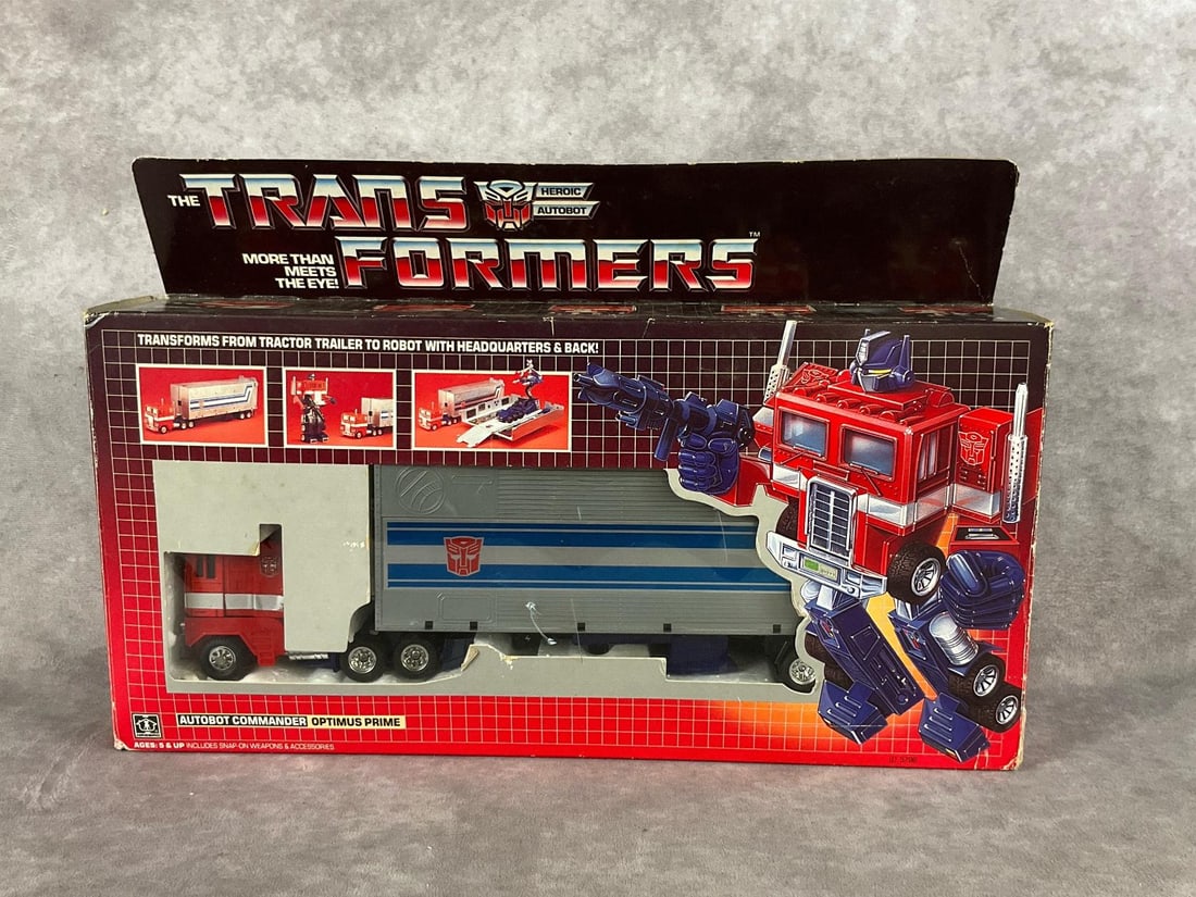 Transformers Autobot Commander Optimus Prime: 1984, No. 5796, made by Hasbro. Appears complete. Includes Optimus Prime tractor-trailer, roller scout car, laser blaster, six wheels, four rockets, two fists, gas pump, nozzle hose, and tech specs