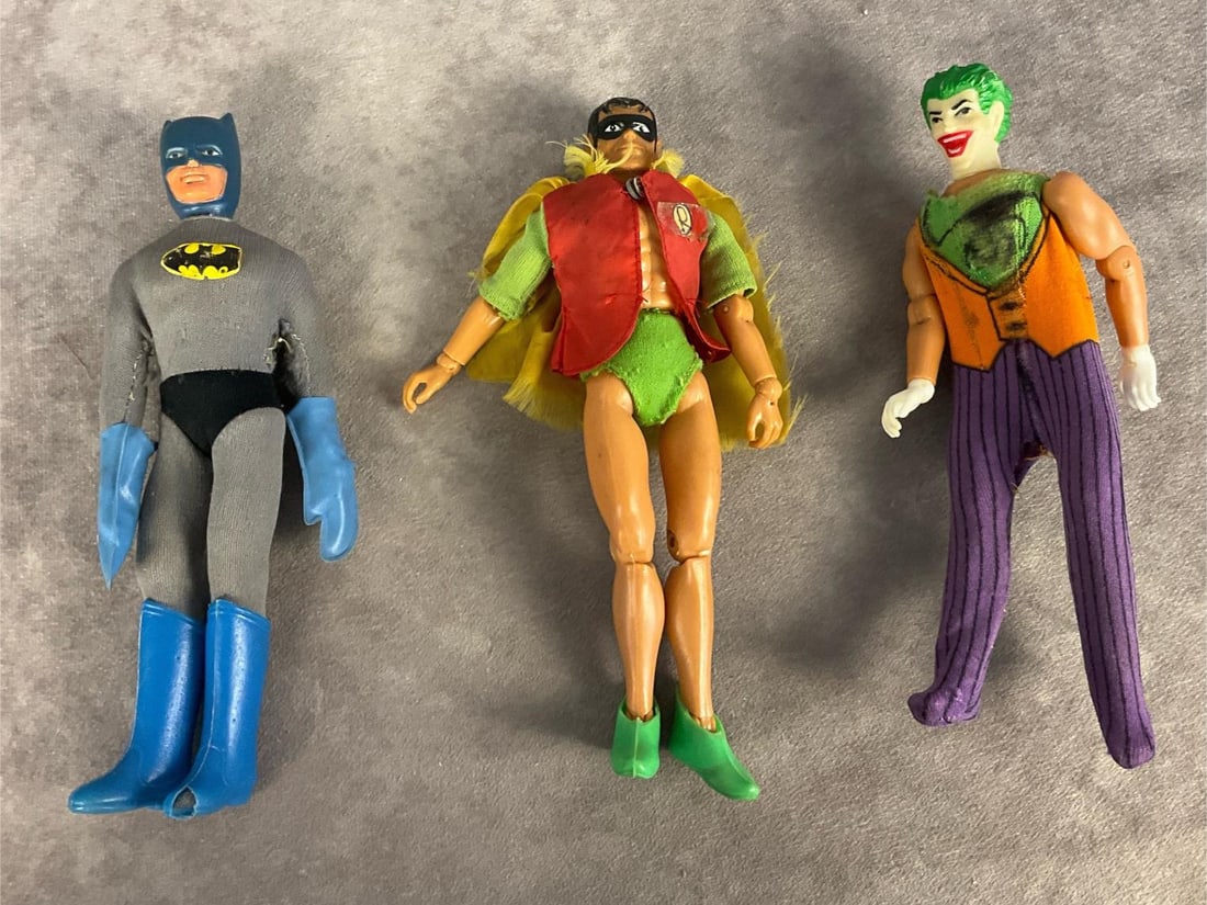 Mego Super Hero Action Figures: Lot of three Mego action figures made in Honk Kong in 1975. Batman has a 1972 dated NPP head, is missing his cape and utility belt, has fraying on his sleeves, a worn logo on his chest, and a hole in