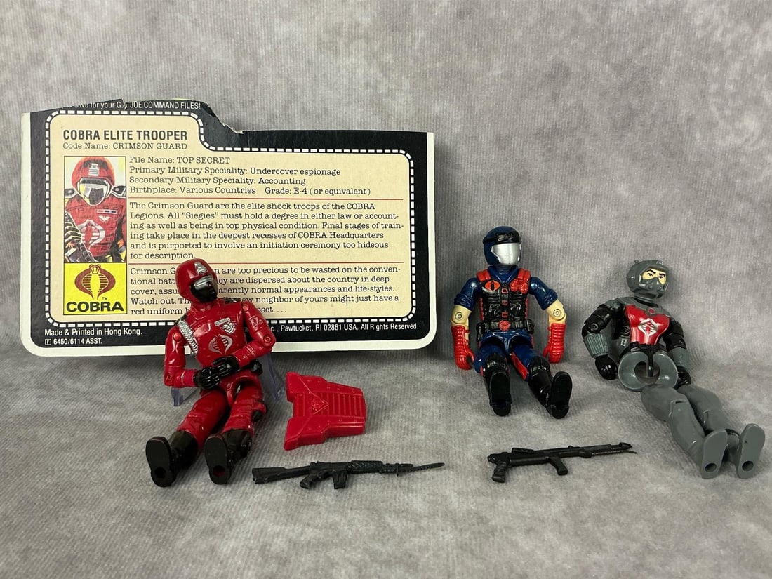 G.I. Joe Action Figures: Three 1985 and 1986 G.I. Joe action figures made by Hasbro in Hong Kong. Includes 1985 Crimson Guard Trooper complete with file card, backpack, and gun, tight joints but loose torso. 1985 Cobra Eel