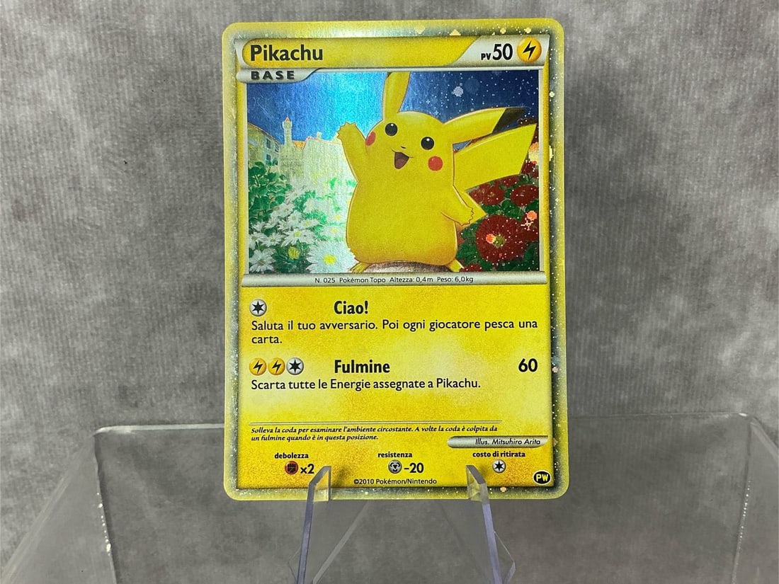 Italian Pikachu: 2010 Pikachu World Collection holographic card in Italian. Good condition. Measures roughly 2.75 inches wide x 3.5 inches tall.