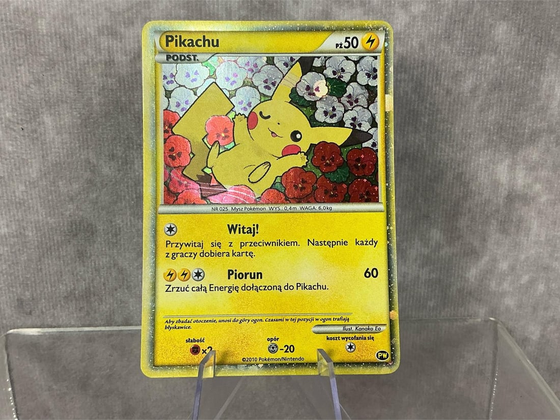 Polish Pikachu: 2010 Pikachu World Collection holographic card in Polish. Good condition. Measures roughly 2.75 inches wide x 3.5 inches tall.
